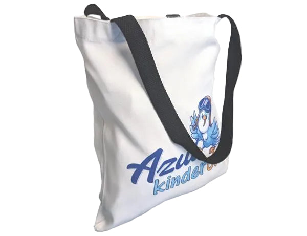 White tote bag with black straps and blue text on a white background